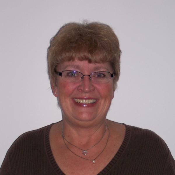 Smiling woman with glasses and short hair