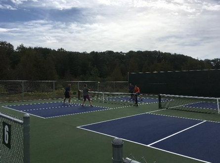 pickleball court from pr from 2020 stephen hannon People playing pickleball on outdoor court.