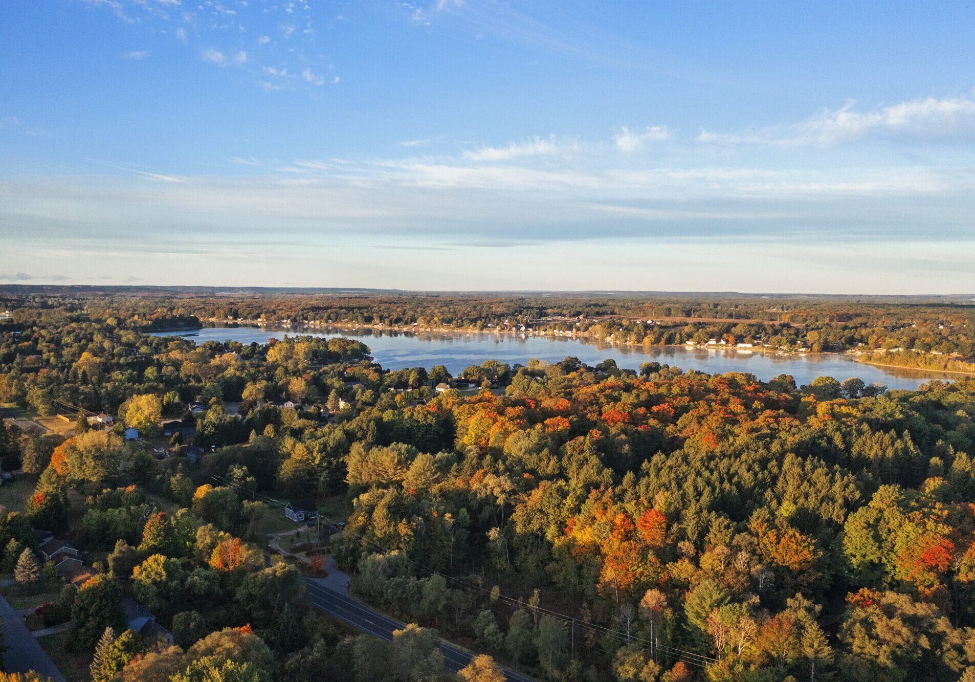 Autumn aerial view of lake and forest scenery.