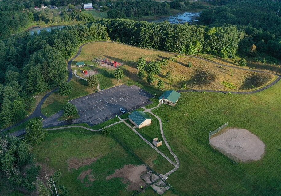 slra 3.dng Aerial view of park with playground and forest.