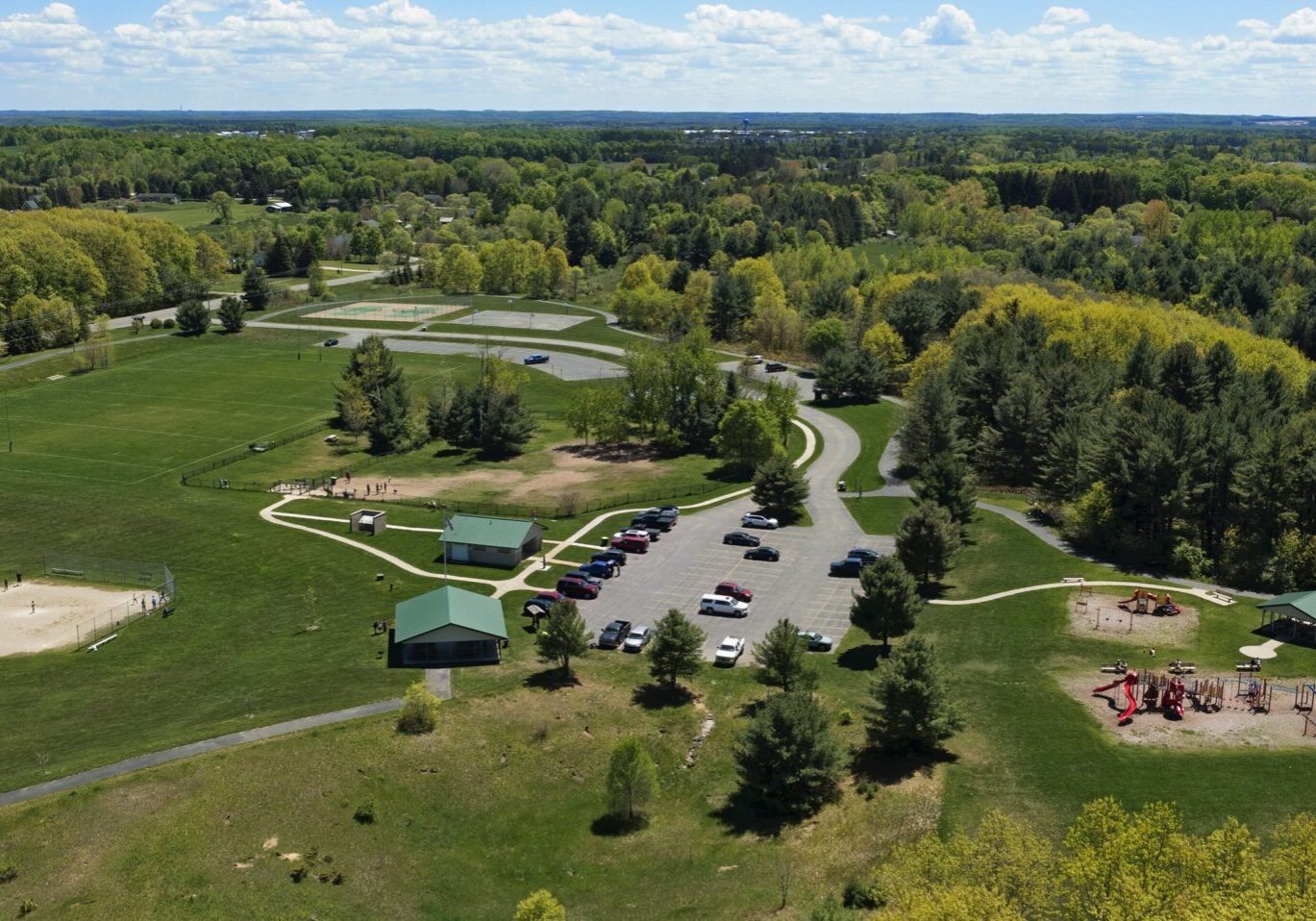 slra field new Aerial view of park with playground and sports fields.